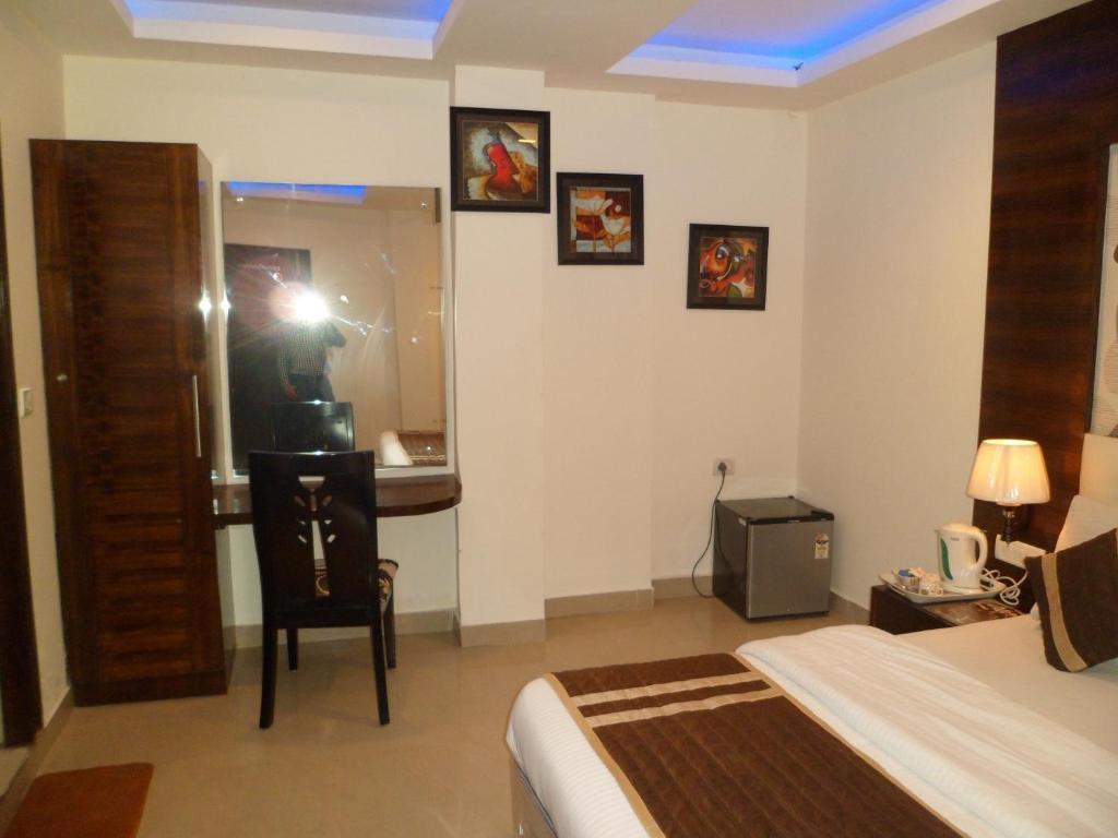 Hotel Arjun Új-Delhi Szoba fotó